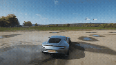 A Silver Sports Car With A License Plate That Says ' Rsc ' On It Is Driving Down A Dirt Road GIF