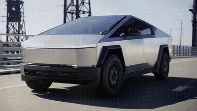 A Silver Tesla Cybertruck Is Driving Down A Bridge GIF