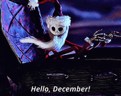 A Skeleton In A Santa Hat Is Sitting In A Coffin And Says Hello December GIF