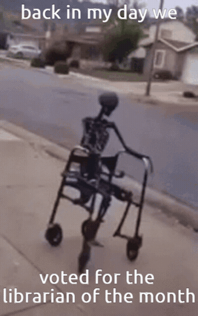 A Skeleton In A Walker With The Words Back In My Day We Voted For The Librarian Of The Month At The Bottom GIF
