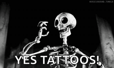 A Skeleton Is Flexing His Muscles In A Black And White Photo With The Words `` Yes Tattoos '' . GIF