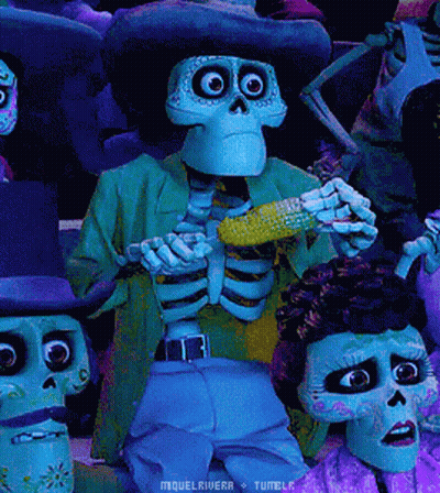 A Skeleton Is Holding A Corn On The Cob In A Crowd GIF