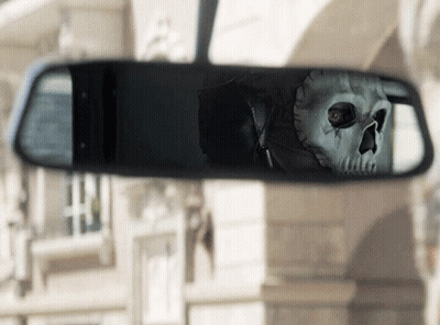 A Skeleton Is Reflected In A Rear View Mirror GIF