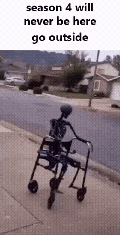 A Skeleton Is Riding A Walker Down A Sidewalk On A Sidewalk . GIF