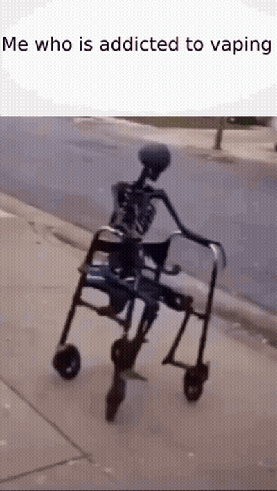 A Skeleton Is Riding A Walker On A Sidewalk . GIF