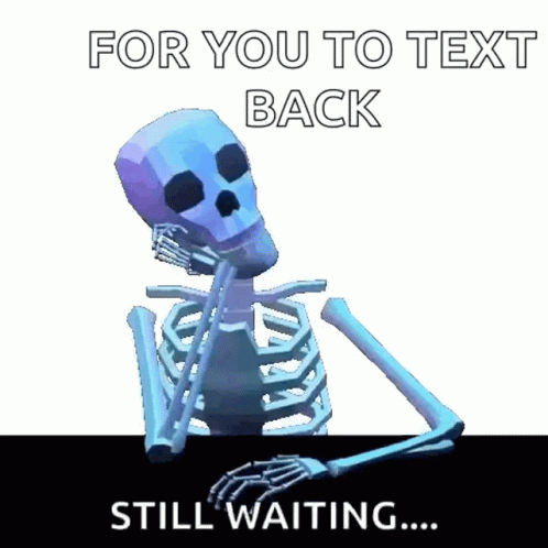 A Skeleton Is Sitting At A Table Waiting For Someone To Text Him Back . GIF