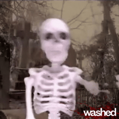 A Skeleton Is Standing In A Cemetery With The Word Washed On The Bottom Right GIF