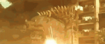 A Skeleton Of A Dinosaur Is Being Displayed In Front Of A Building In A Museum . GIF