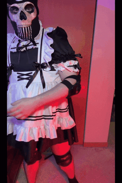 A Skeleton Wearing A Maid Costume With A Bow GIF