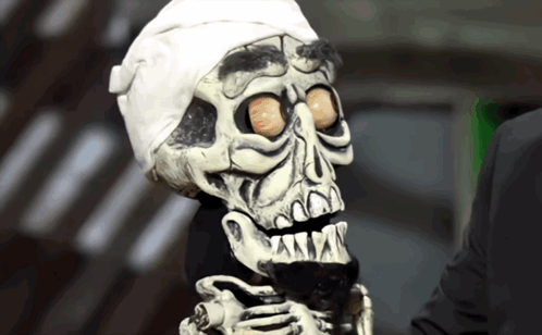A Skeleton With A Bandaged Head And A White Headband GIF