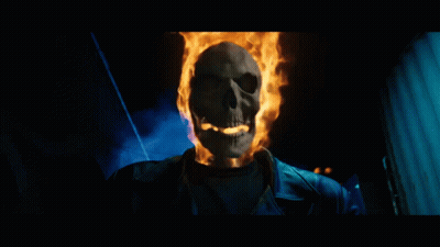 A Skeleton With Flames Coming Out Of It 'S Head GIF