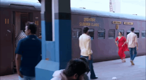A Sleeper Class Train Is Pulling Into A Station GIF
