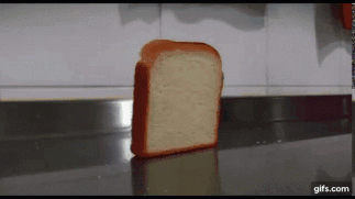 A Slice Of Bread Is On A Counter With A Gifs.com Watermark GIF