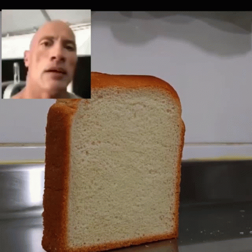 A Slice Of Bread With A Picture Of A Bald Man In The Background GIF