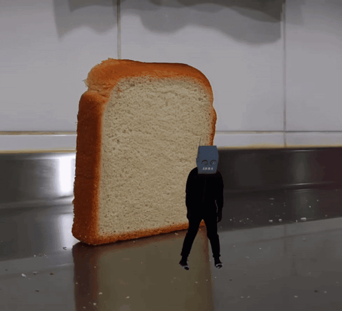A Slice Of Bread With A Robot Face On It GIF