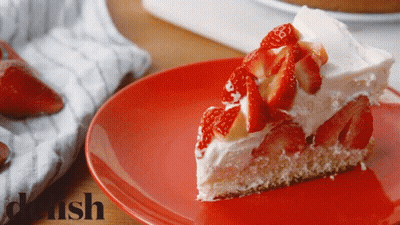 A Slice Of Cake On A Red Plate With Danish Written On The Bottom GIF