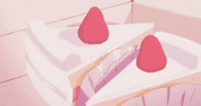 A Slice Of Cake With Strawberries On Top Of It GIF