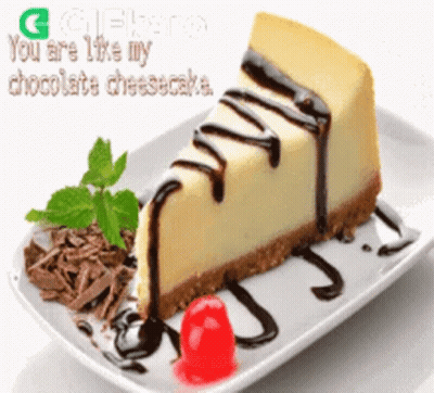 A Slice Of Chocolate Cheesecake With A Cherry On A Plate GIF