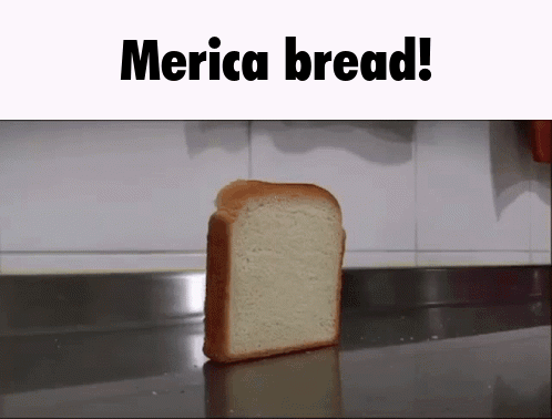 A Slice Of Merica Bread Is Sitting On A Counter Top GIF