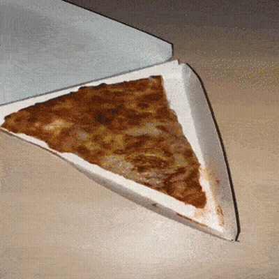 A Slice Of Pizza Is In A Cardboard Box On A Table GIF