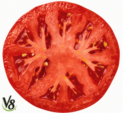 A Sliced Tomato With A V8 Logo On The Bottom Right GIF
