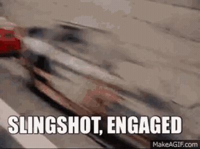 A Slingshot Engaged Gif With A Car Driving Down A Highway . GIF