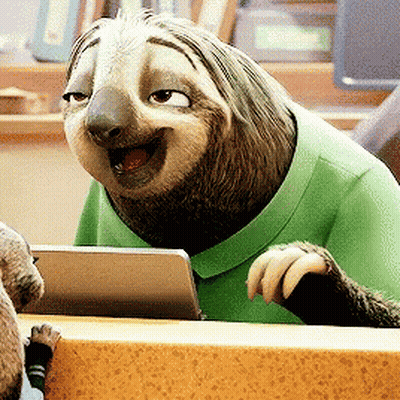 A Sloth Is Wearing A Green Shirt And Smiling While Looking At A Tablet GIF