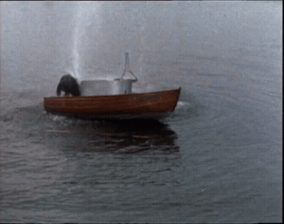 A Small Boat Is Floating On A Body Of Water And Has The Name ' Amanda ' On The Side GIF