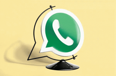A Small Globe With A Green And White Whatsapp Logo On It GIF