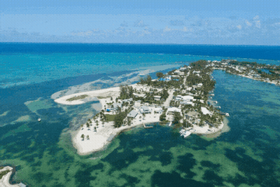 A Small Island In The Middle Of A Body Of Water GIF