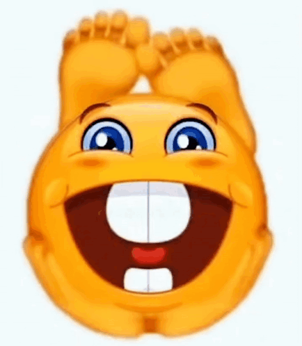 A Smiley Face Is Laughing With Its Feet Up And A Big Smile On Its Face . GIF