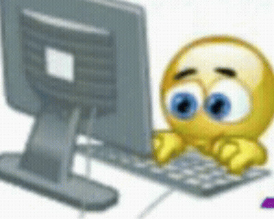 A Smiley Face Is Typing On A Keyboard In Front Of A Computer . GIF