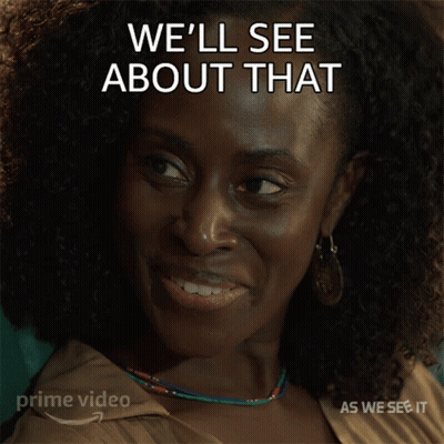 A Smiling Woman With The Words We 'Ll See About That Behind Her GIF