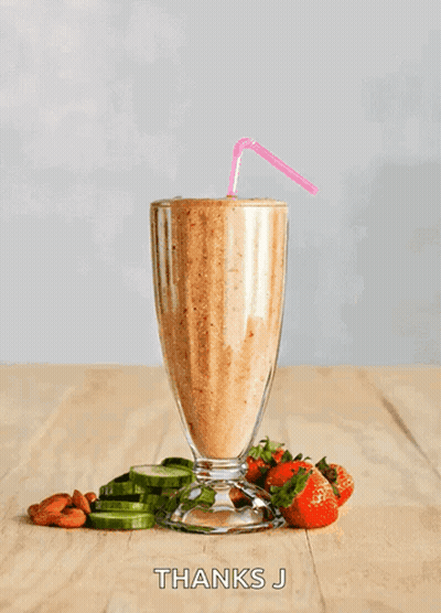 A Smoothie In A Tall Glass With Straws Next To Strawberries And Cucumbers And The Words Thanks J Below It GIF