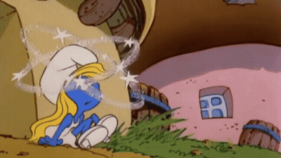 A Smurf Is Sitting In Front Of A Pink Building GIF