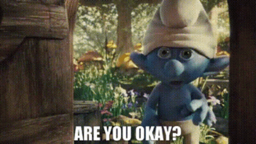 A Smurf Is Standing In A Garden And Asking Are You Okay ? GIF