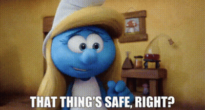 A Smurf Is Standing In A Room With The Words `` That Thing 'S Safe , Right ? '' Written On The Screen . GIF