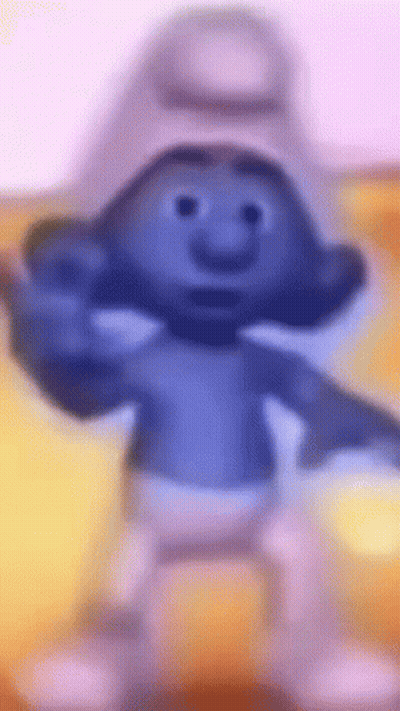 A Smurf Is Standing On A Yellow Surface And Giving A Middle Finger . GIF