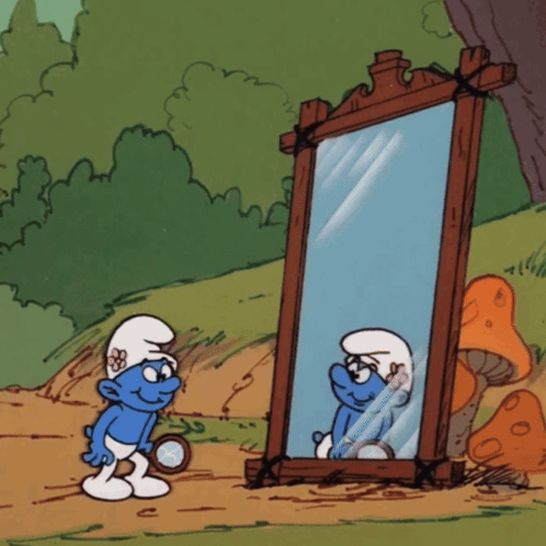 A Smurf Looking At Himself In A Mirror GIF