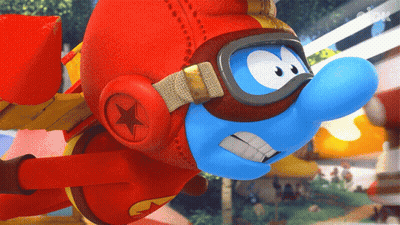 A Smurf Wearing A Red Helmet And Goggles Flies Through The Air GIF