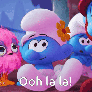 A Smurf With A Flower In His Hat Is Sitting Next To Another Smurf GIF
