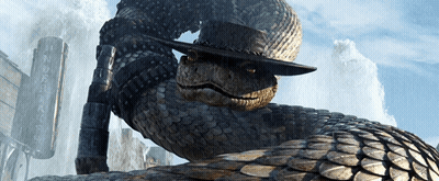 A Snake Wearing A Cowboy Hat Is Standing In Front Of A Sign That Says ' Ranch ' On It GIF
