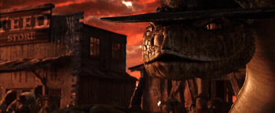 A Snake Wearing A Cowboy Hat Stands In Front Of A Store That Says Feed Store GIF