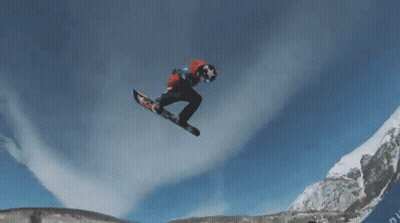 A Snowboarder Is Doing A Trick In The Air While Wearing A Red And White Jacket GIF