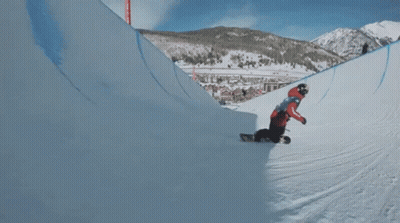 A Snowboarder Is Doing A Trick In The Air With The Letter P On His Knee GIF