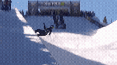 A Snowboarder Is Doing A Trick On A Snowy Slope In Front Of A Sign That Says Dew Tour GIF
