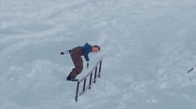 A Snowboarder Is Doing A Trick With The Word Burton On The Board GIF