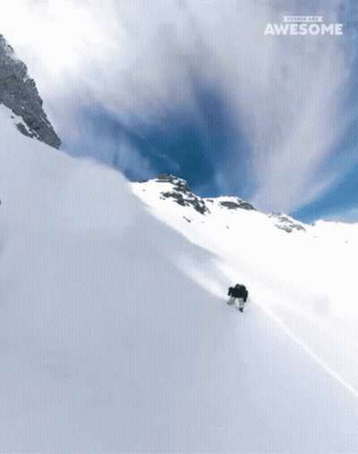 A Snowboarder Is Going Down A Snow Covered Slope With The Words " People Are Awesome " On The Bottom GIF