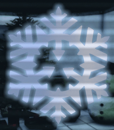 A Snowflake Is Visible In A Dark Room GIF