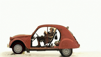 A Snowman Is Standing Next To A Car With A Christmas Tree On Top GIF